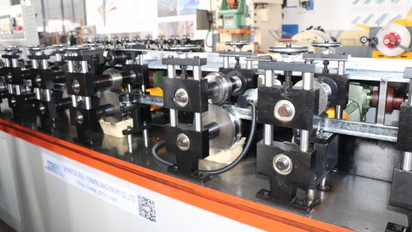 Close-up view of the roller forming section of the T-Bar Roll Forming Machine.