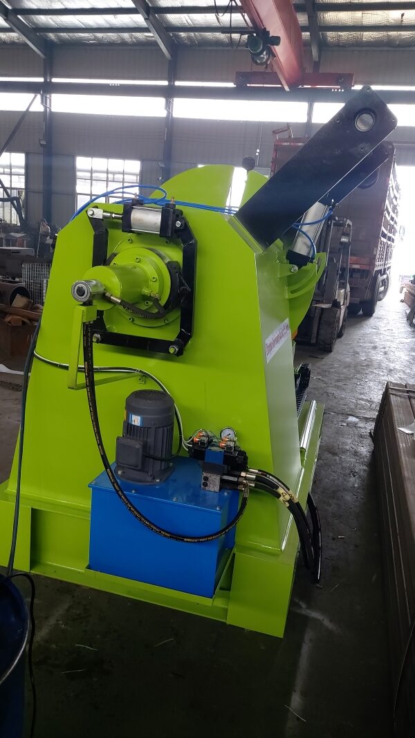 DeCoiler machine with blue hydraulic power unit.