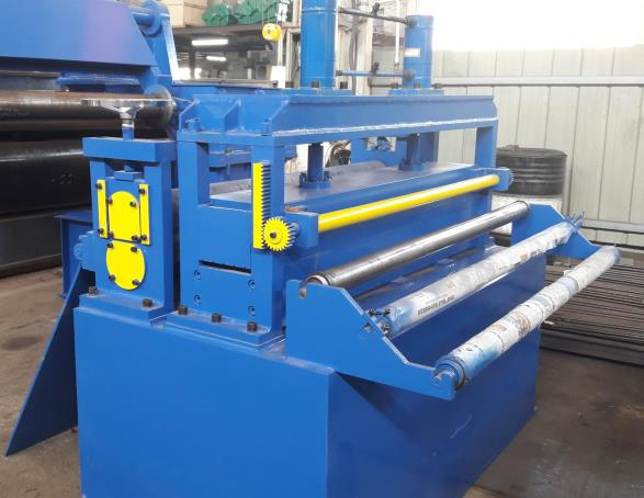 Blue tension stand unit, part of a hydraulic slitting line, guiding finished strips and maintaining coil tension during rewinding.